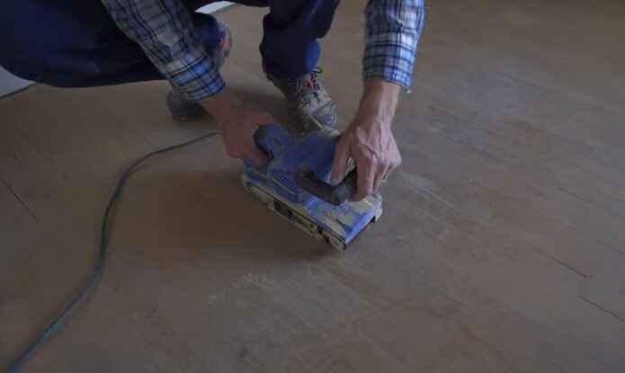 Can you use a regular belt sander to sand laminate flooring