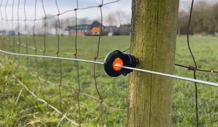 How can you prevent an electric fence from starting a fire
