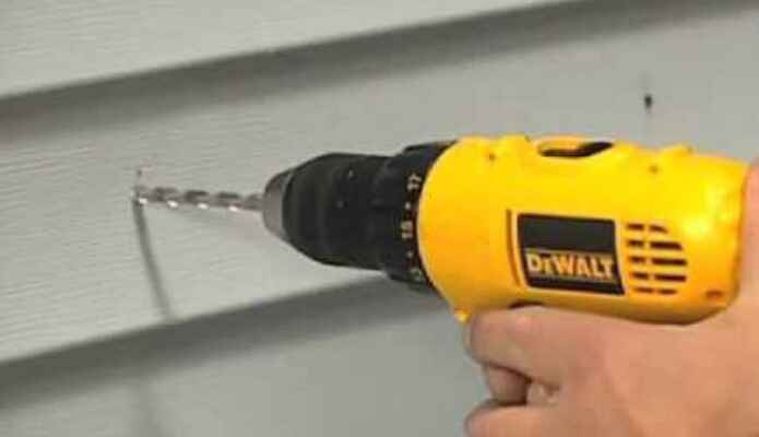 How to drill into the siding of a house