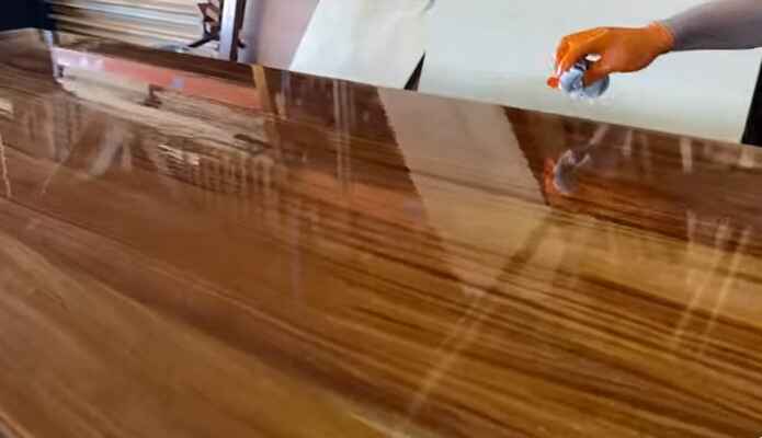 What precautions need to be taken when sanding polyurethane off wood